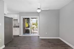 Los Angeles apartment for rent - A spacious living room with a sliding glass door leading to a balcony.