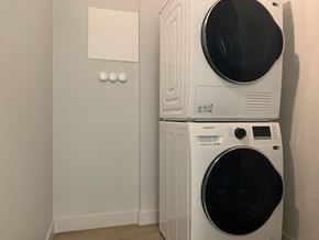 Langford apartment for rent - A white Samsung washing machine and dryer stacked on top of each other.