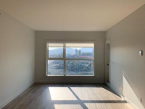 Langford apartment for rent - A room with a large window overlooking a snowy landscape.
