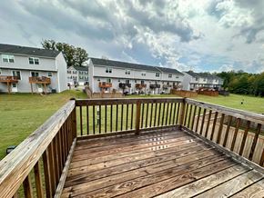 Greenville house for rent - a large deck with a view of an apartment building