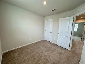 Greenville house for rent - a bedroom with a carpeted floor and white doors