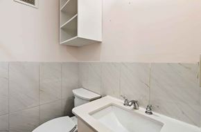 Washington apartment for rent - A white toilet and sink in a bathroom.