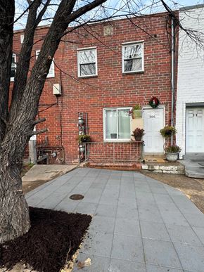 Washington apartment for rent - A red brick house with a white door and a mailbox on the front.