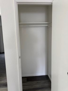 Portland apartment for rent - A white closet with a door open.