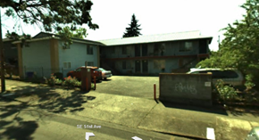 Portland apartment for rent - A white building with a red fire hydrant in front of it.