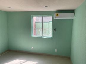 Pasadena house for rent - an empty room with green walls and a window