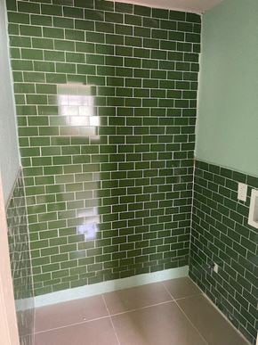 Pasadena house for rent - a bathroom with green subway tile on the wall