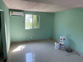 Pasadena house for rent - a room with green walls and a white tiled floor and a window