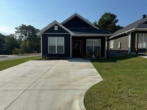 Little Rock house for rent - a blue house with a sidewalk in front of it