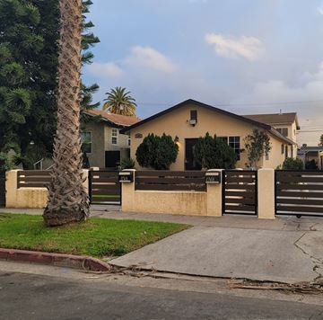 Los Angeles apartment for rent - a house with a fence and a palm tree