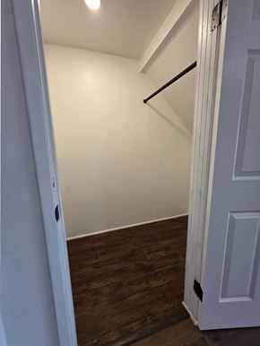 Los Angeles apartment for rent - A white door is open to a room with wood flooring.