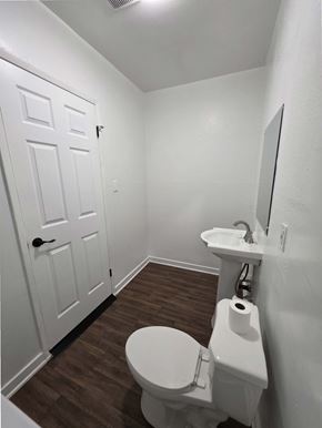 Los Angeles apartment for rent - A white toilet with a white sink in a small bathroom.