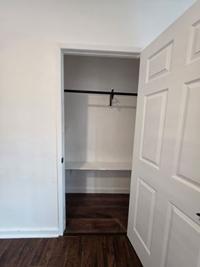 Los Angeles apartment for rent - A white door with a black handle and a coat rack.