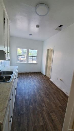 Los Angeles apartment for rent - A kitchen with wooden floors and white walls.