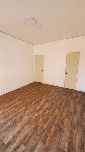 Los Angeles apartment for rent - A room with wooden flooring and two doors.
