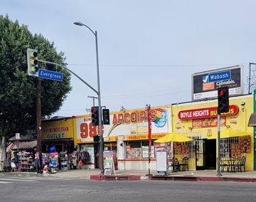 Los Angeles apartment for rent - A street corner with a traffic light and a sign for Evergreen.