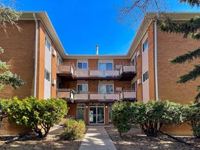 Regina apartment for rent - A multi-story apartment building with a courtyard in the middle.