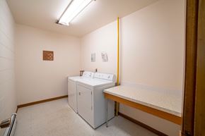 Regina apartment for rent - A bathroom with a sink and a toilet.