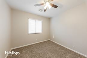 Mesa house for rent - a bedroom with a ceiling fan and a window
