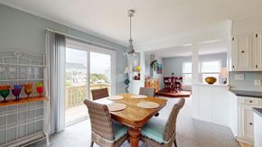 Emerald Isle house for rent - a dining room with a wooden table and chairs