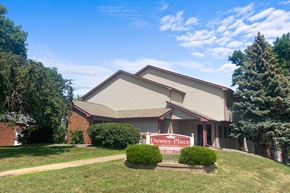 Foley apartment for rent - A house with a red sign that says Dewey Place.