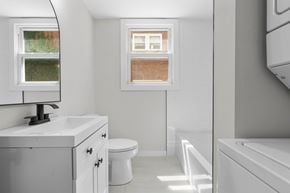 Hamden apartment for rent - A white bathroom with a toilet, sink, and bathtub.