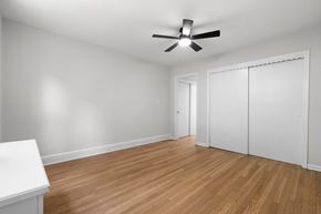 Hamden apartment for rent - A room with a ceiling fan and wooden flooring.