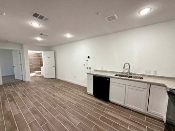 San Antonio apartment for rent - a kitchen and living room with a sink and a counter