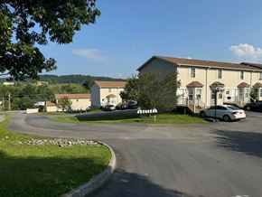 Jonesborough apartment for rent - A white car is parked in front of a house.