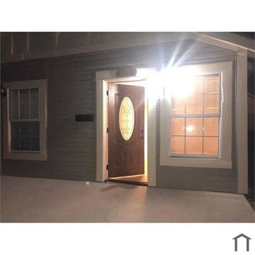 Harvey house for rent - the front door of a house with the light shining on it