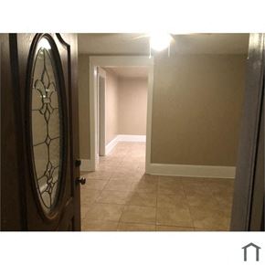 Harvey house for rent - an empty hallway with a door with a mirror