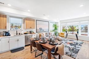 Newark apartment for rent - A modern kitchen with a dining table set for four.
