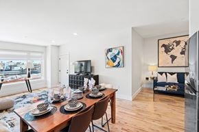 Newark apartment for rent - A dining room with a wooden table set for six.