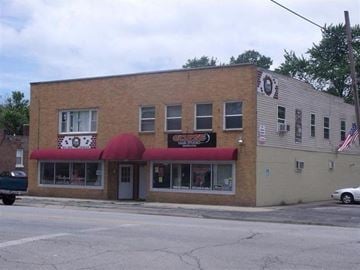 Lake Station apartment for rent - a building with a red awning on the side of a street