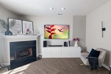 Hubert house for rent - a living room with a fireplace and a couch