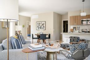 Milwaukee apartment for rent - a pool and lounge furniture in front of a building