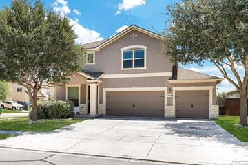 San Antonio house for rent - a house with a driveway and a garage door