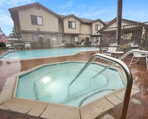 Redlands apartment for rent - A small pool with a ladder in front of a house.