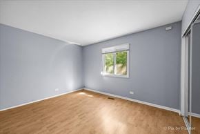 Country Club Hills house for rent - a room with blue walls and a window and wooden floors