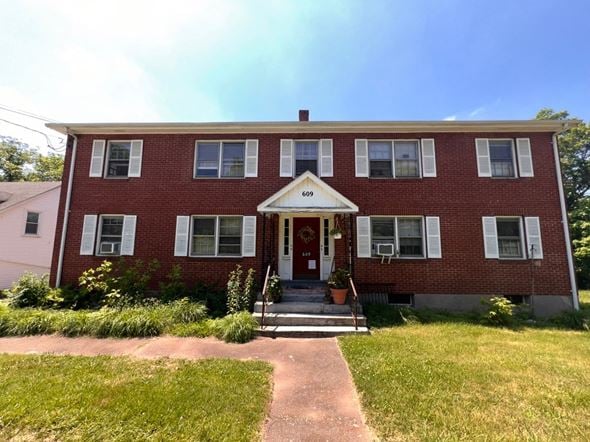 Vernon apartment for rent - A red brick house with a white door and windows.