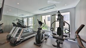Los Angeles apartment for rent - a gym with treadmills and other exercise equipment in a glass walled room