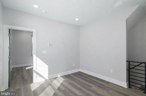 Philadelphia apartment for rent - a empty room with a staircase and a door