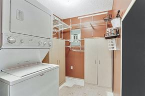 Calgary house for rent - A white oven and dishwasher in a kitchen with brown walls.