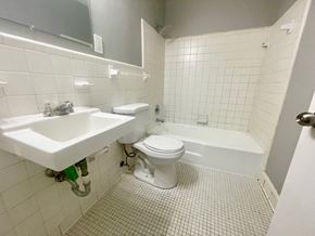 Louisville apartment for rent - a bathroom with a toilet and a sink and a bath tub