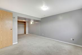 Calgary apartment for rent - a empty living room with a door to a closet