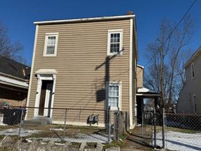 Louisville apartment for rent - A two-story house with a brown siding and a white trim.