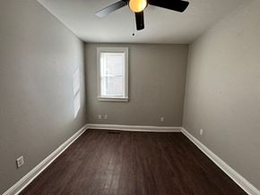 Louisville apartment for rent - A room with a ceiling fan and a window.