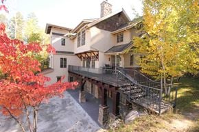 Whitefish house for rent - a large house with a bridge in front of it