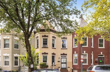 Washington apartment for rent - a brick building with a tree in front of it