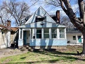 Louisville house for rent - A blue house with the number 717 on the front door.